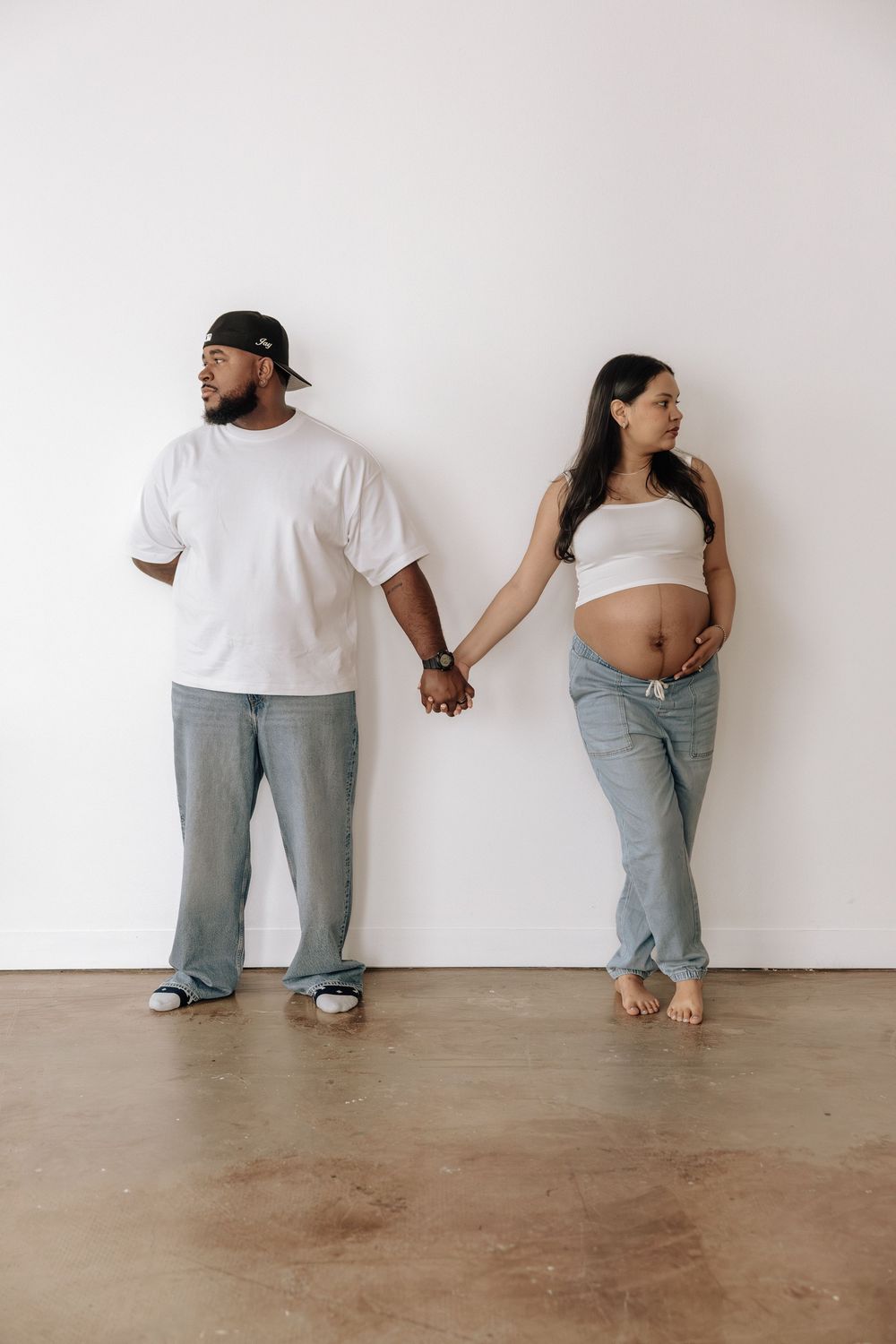 Lifestyle maternity photographer in Rochester capturing candid studio moments