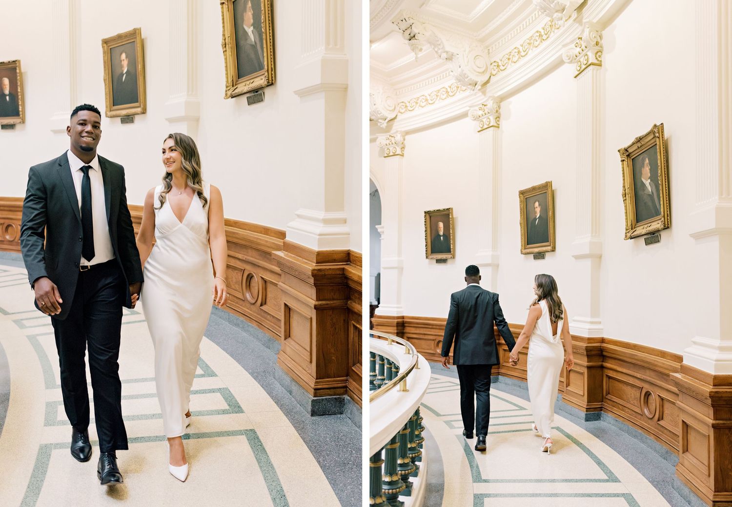 A couple walking up an elegant marble staircase with ornate details and framed portraits on the wall.