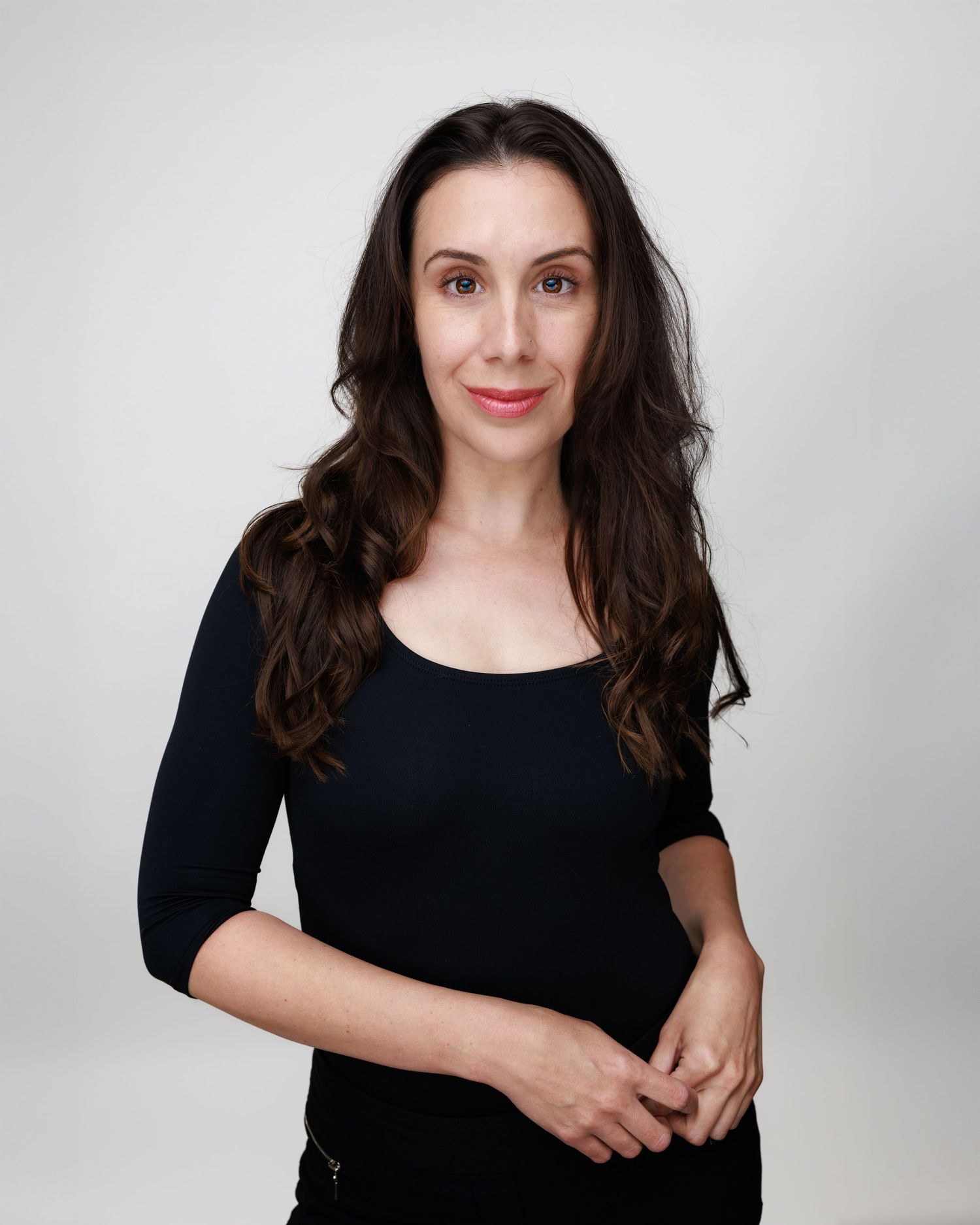 Professional portrait series showing person in black top against light background with varying poses and expressions.