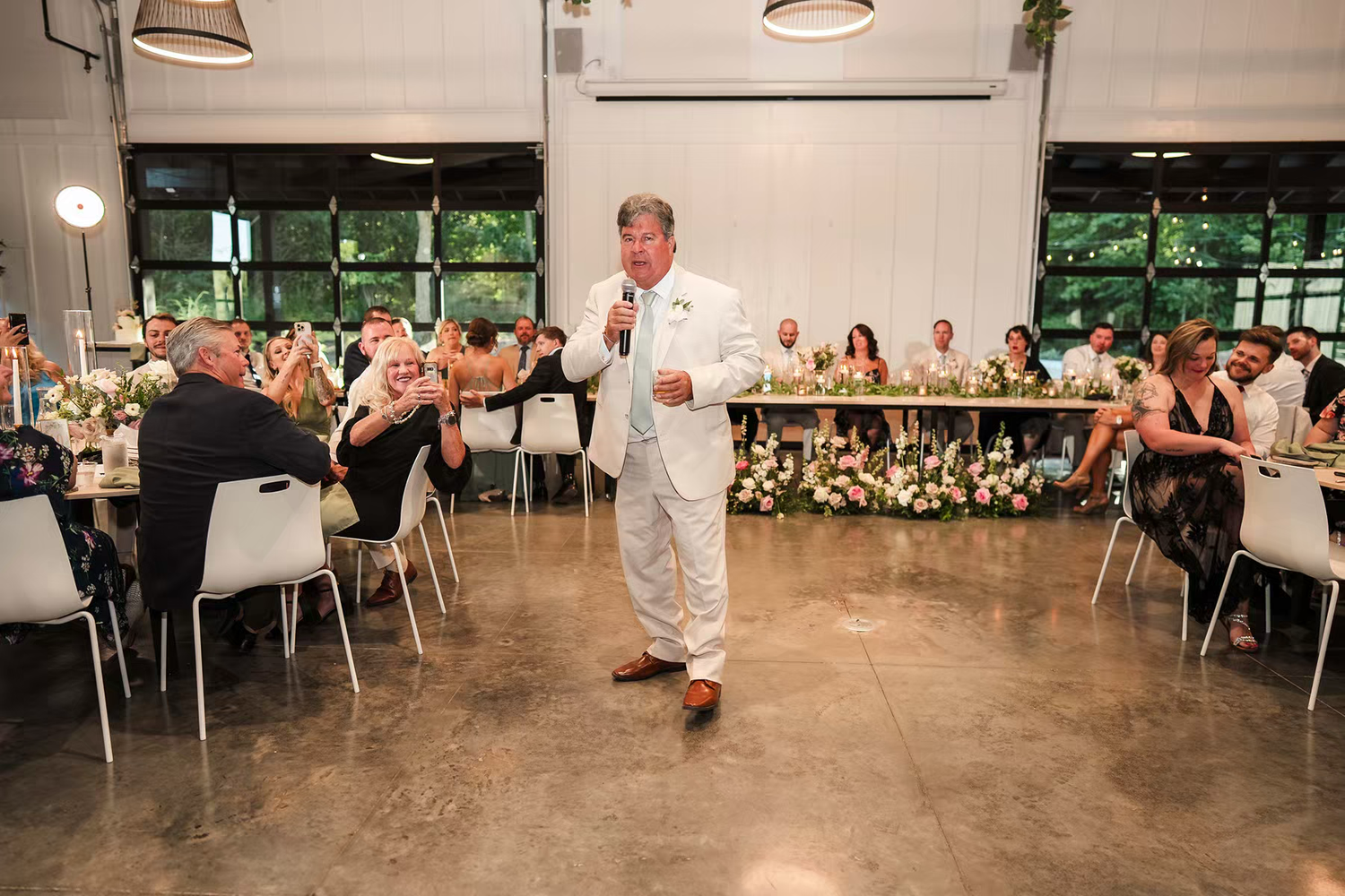 guests gather in the large reception space in  Retreat 21 Wedding Venue