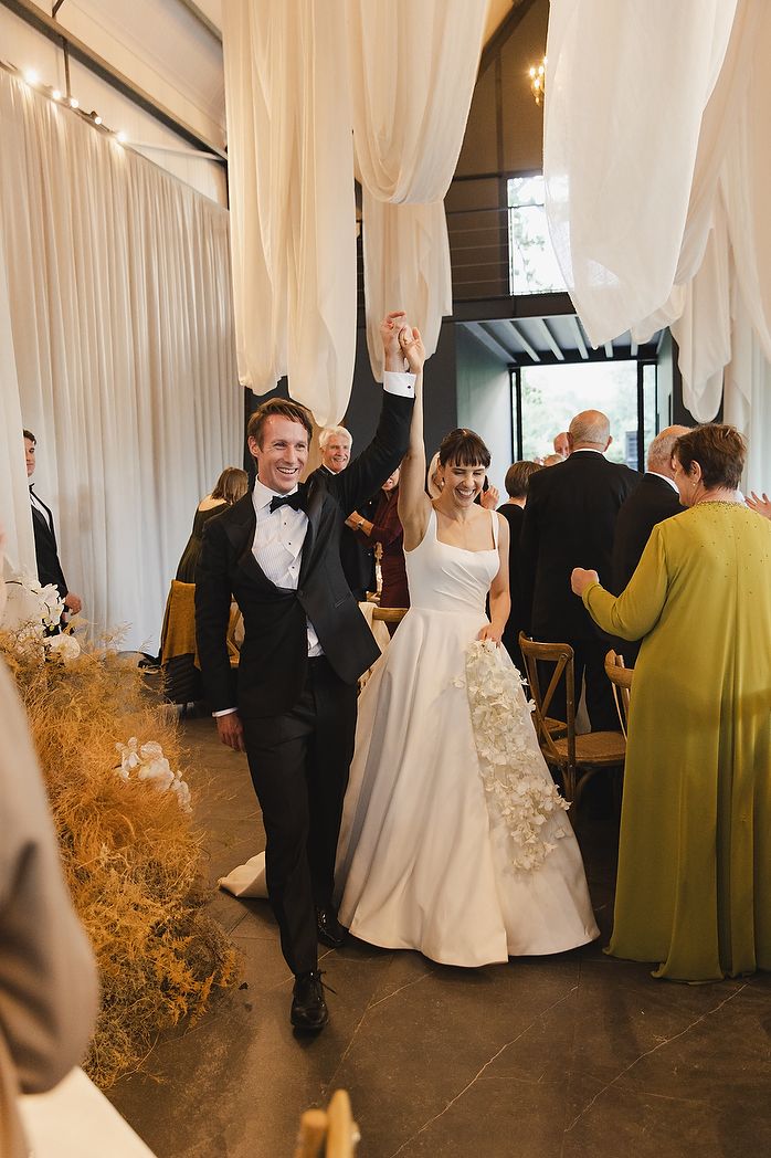 Bride and groom entering the reception venue.