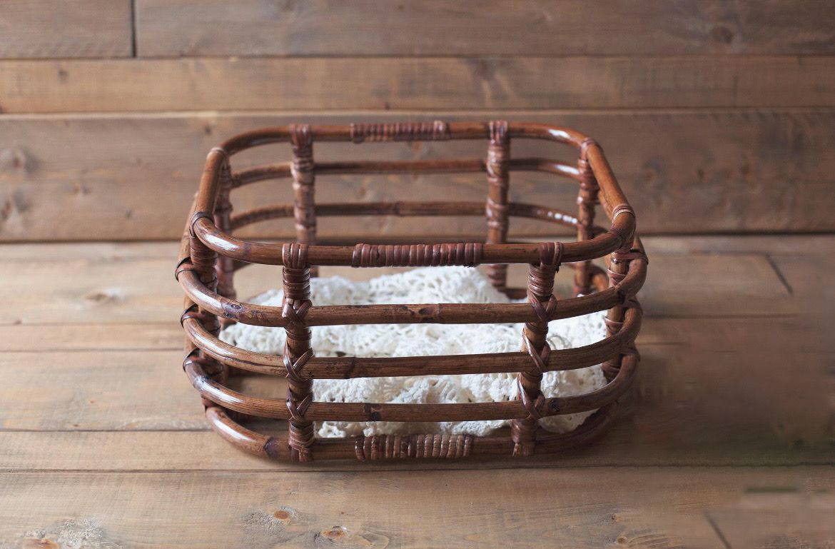 Multiple views of a weathered brown leather baseball glove resting on a rustic wooden surface.
