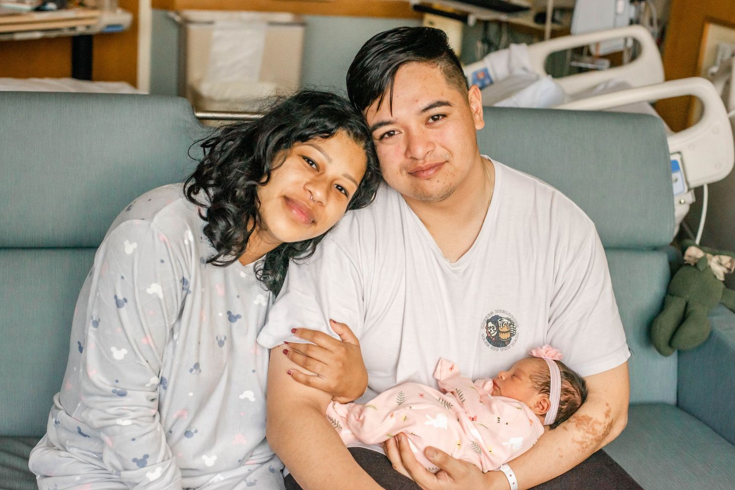 A couple shares tender moments with their newborn baby in a series of hospital photos showing their first moments as parents.
