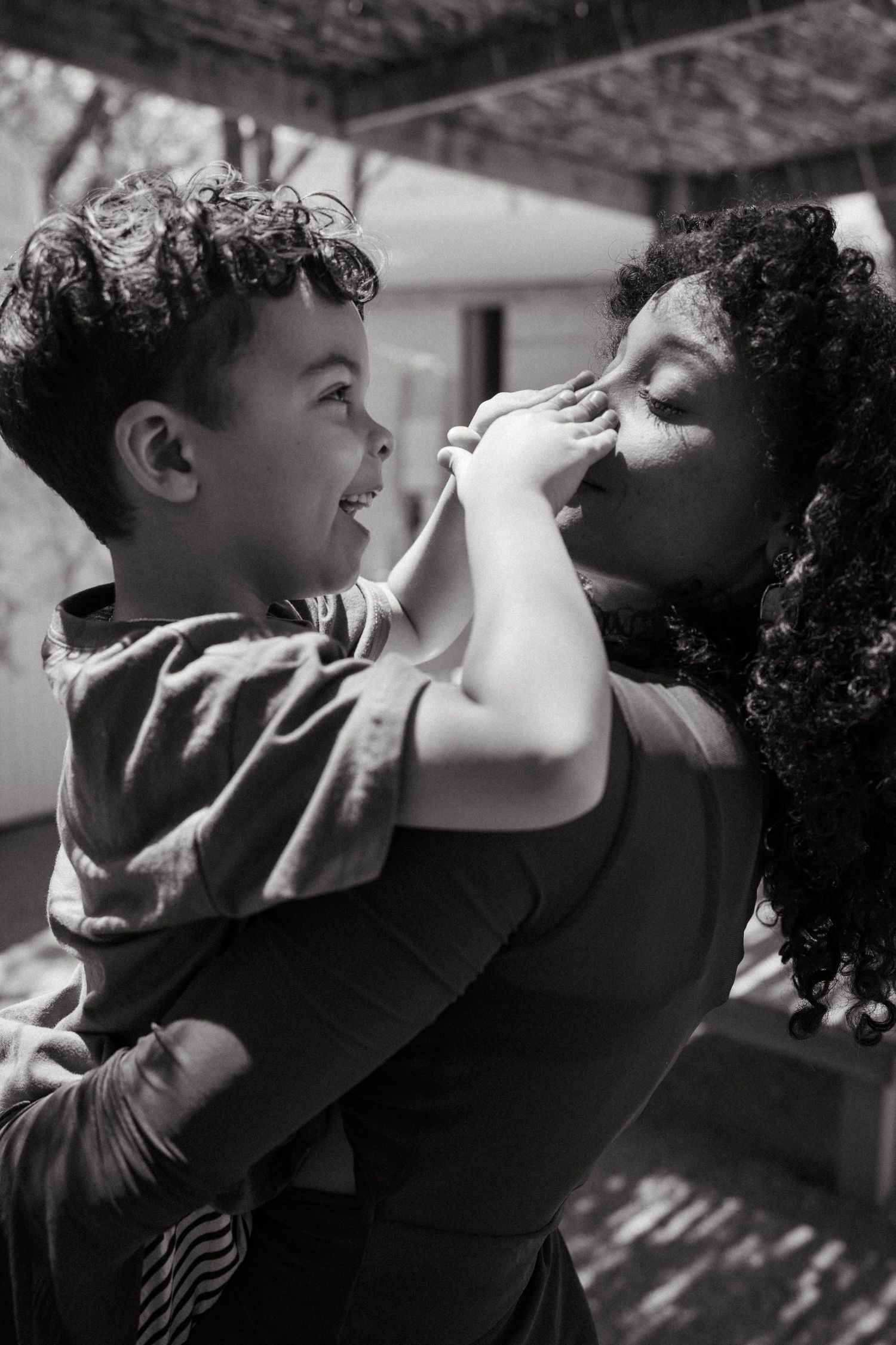 Series of black and white profile shots showing intimate moments in natural light.