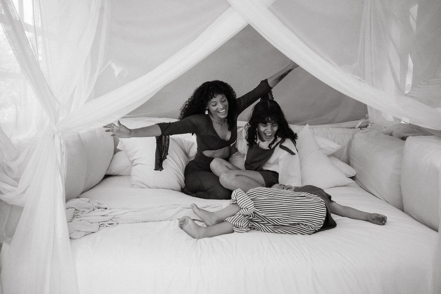 Series of intimate moments captured under flowing white canopy.