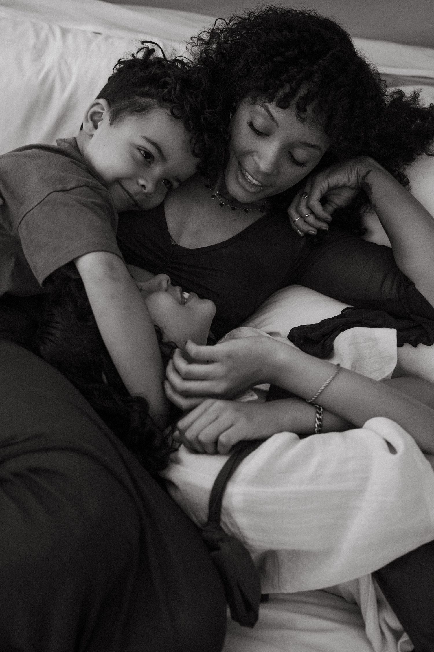 Intimate black and white photography series capturing tender moments between parent and child.