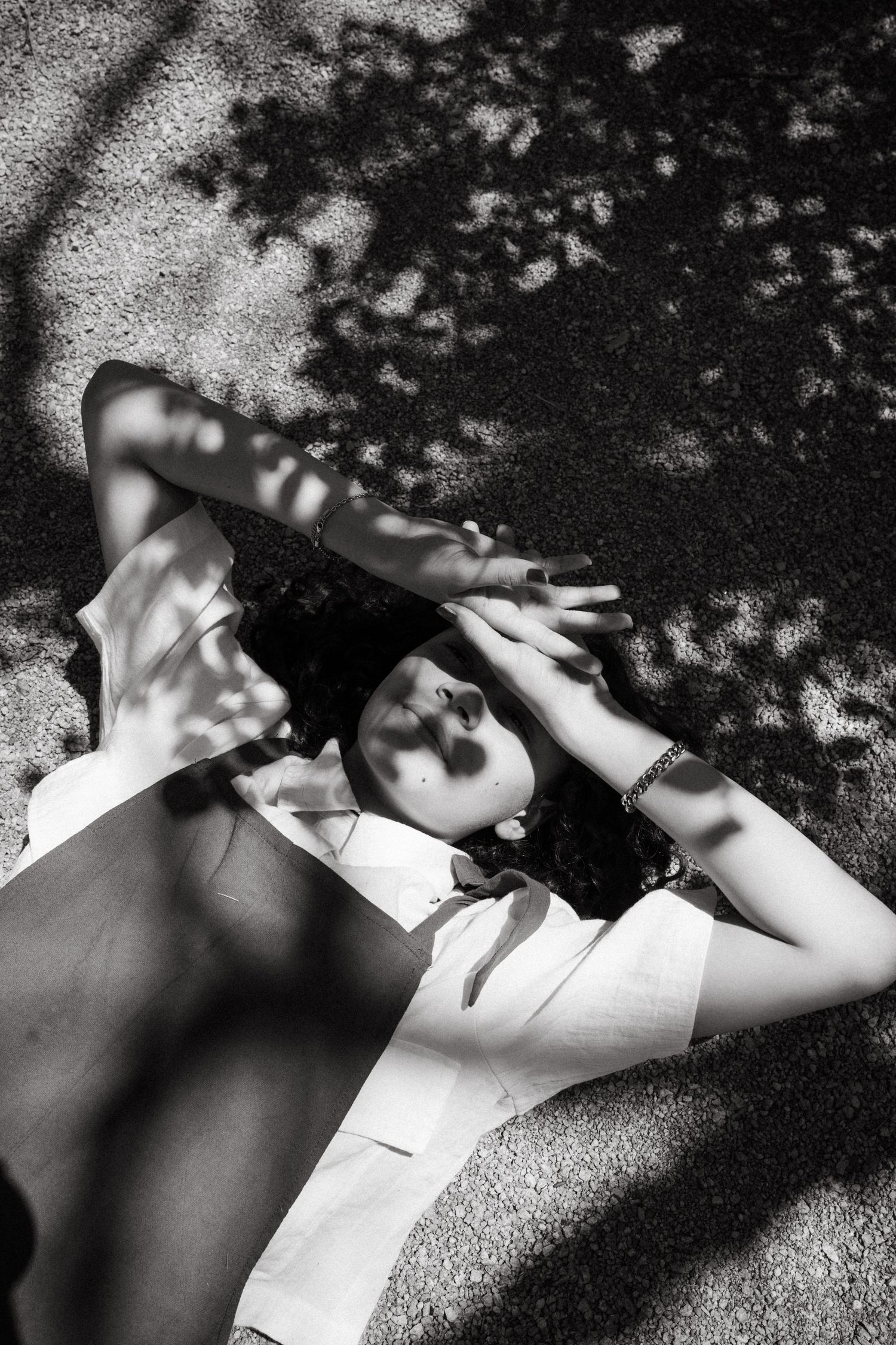 Artistic black and white photos with dappled light and shadow patterns.