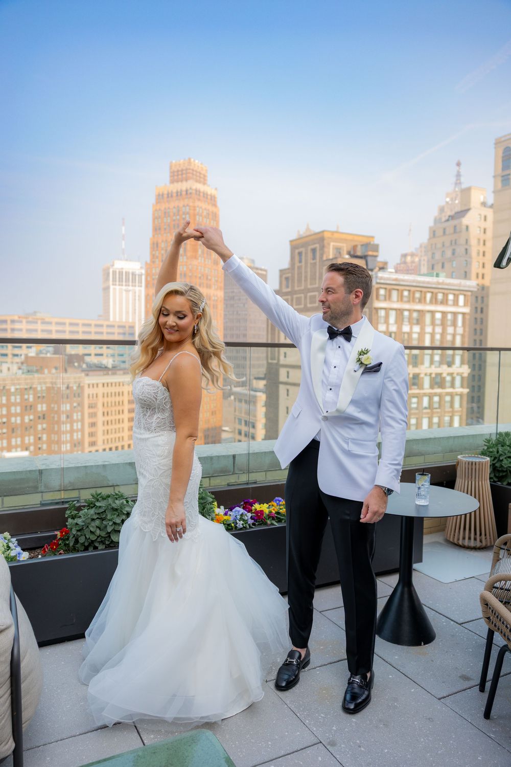 Bride and groom dancing on rooftop