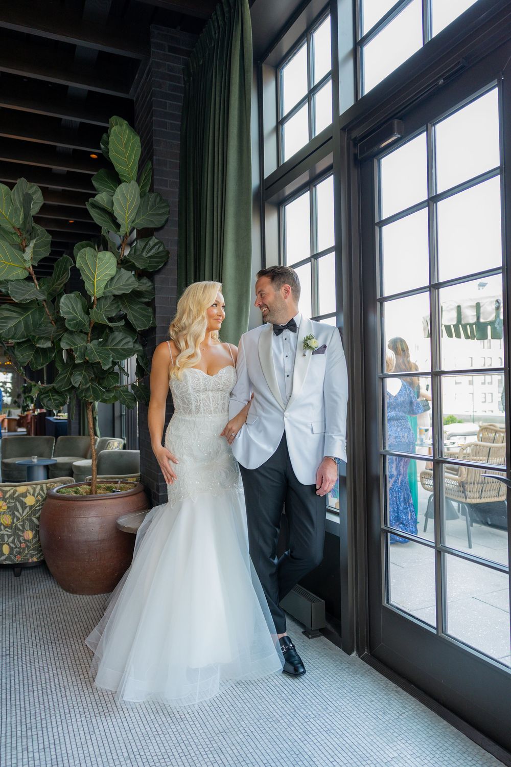 Bride and from standing by window in Miami