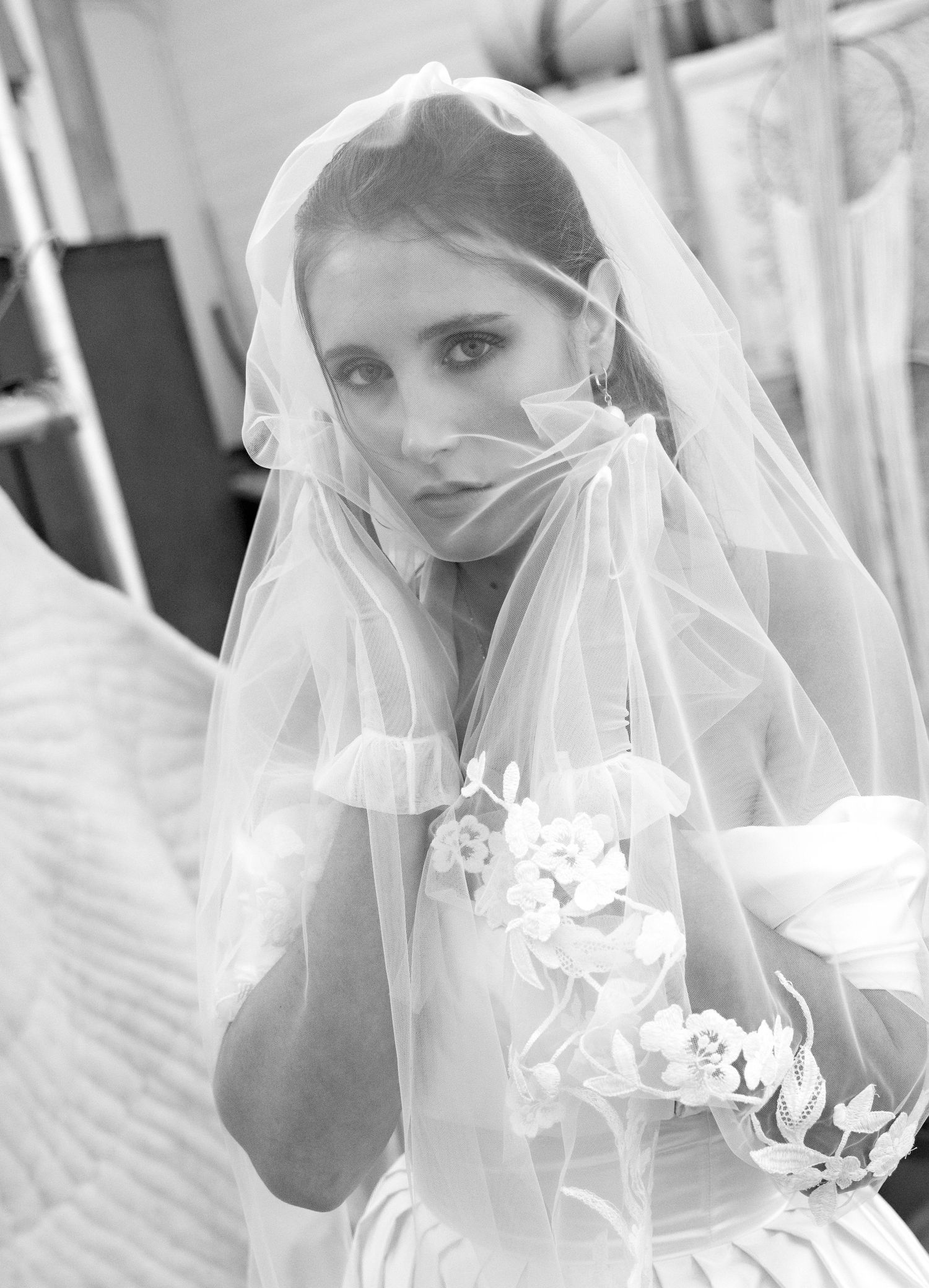 High key black and white bridal portraits with flowing veil details.