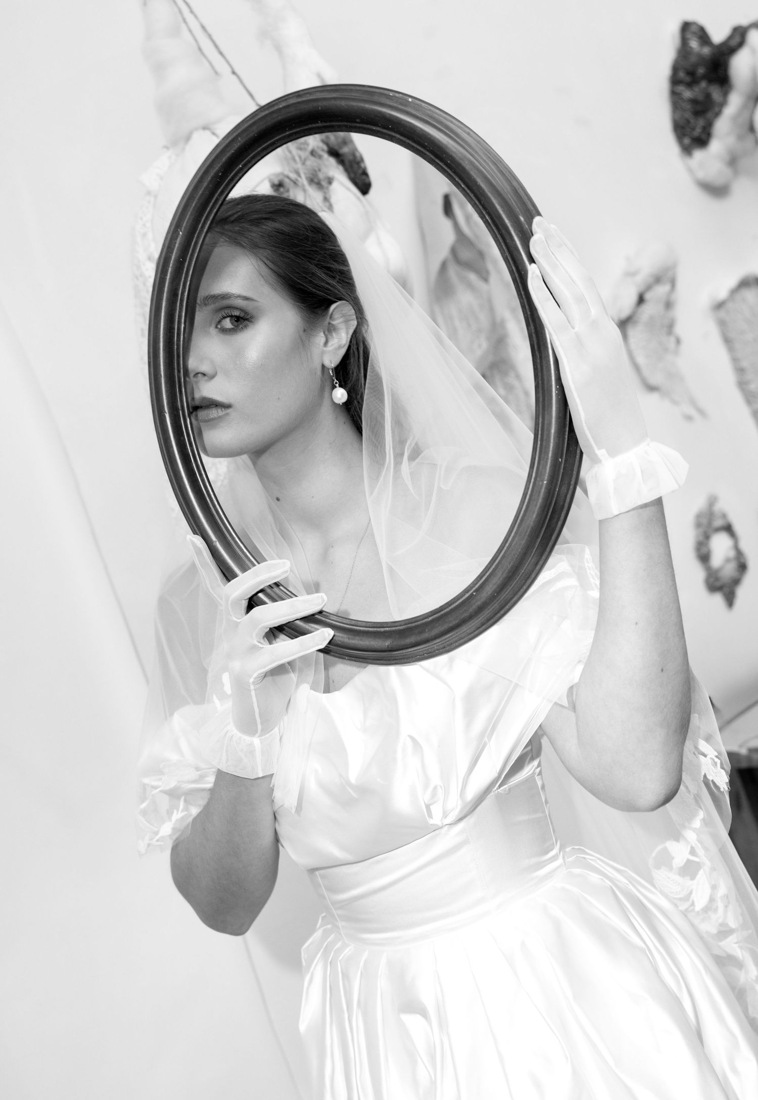 Artistic series featuring circular mirror reflections and white bridal attire.