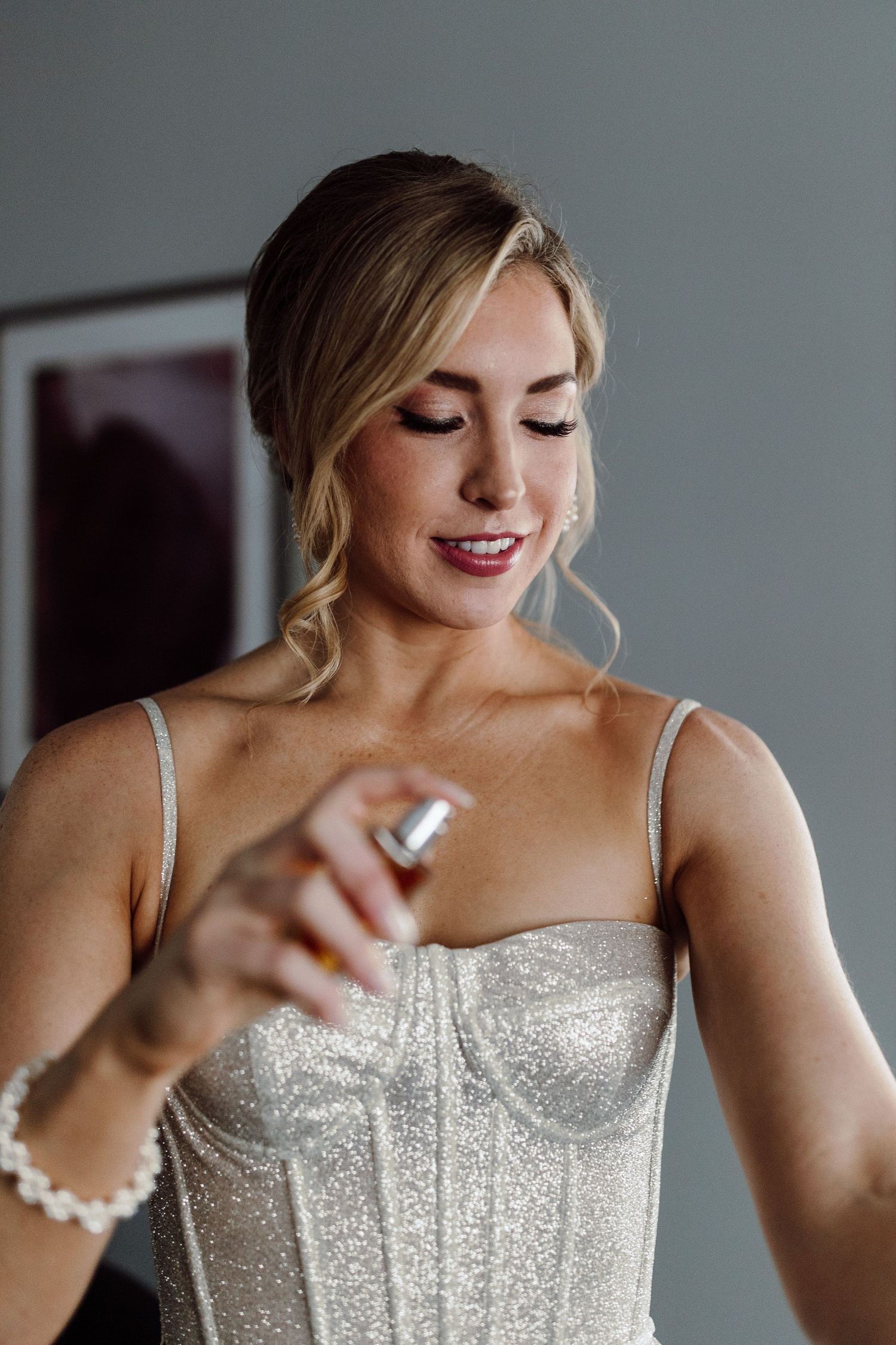 Sparkly white corset-style dress with thin straps and intricate beading details.