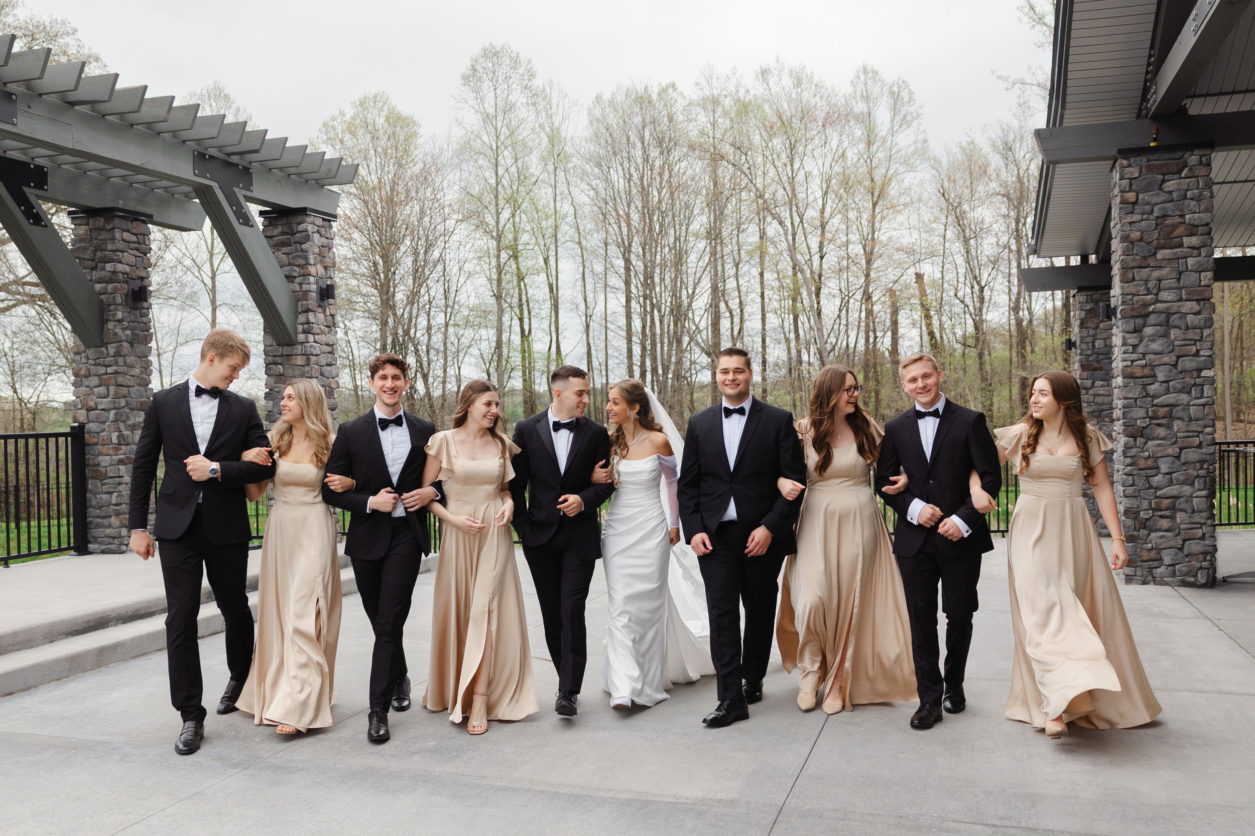 Bridal party walking outside Reserve at Stone Creek in North Canton photographed by Tom Forrest from Hudson, Ohio.