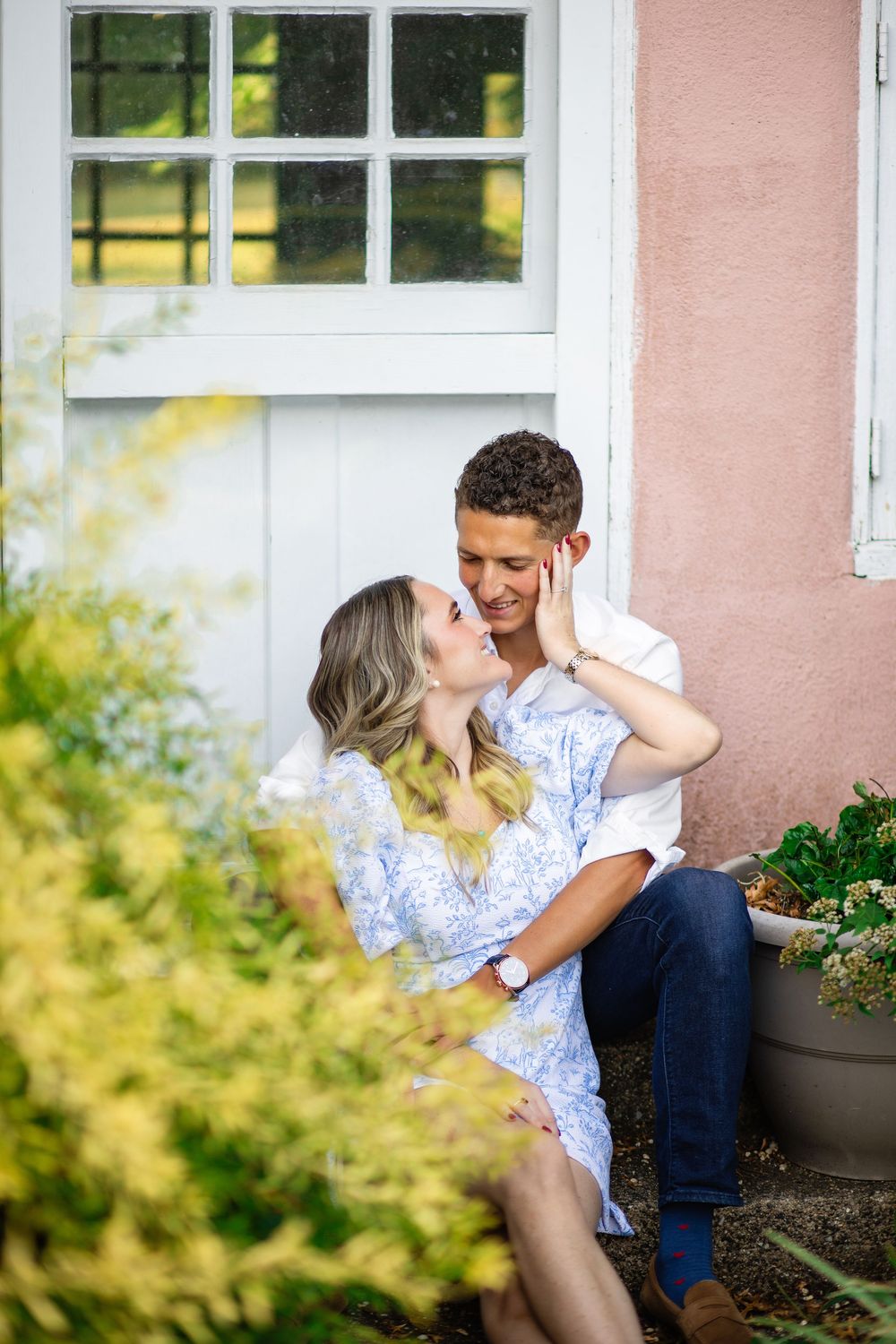 A romantic couple sits together on outdoor steps, sharing intimate moments across multiple candid photos.