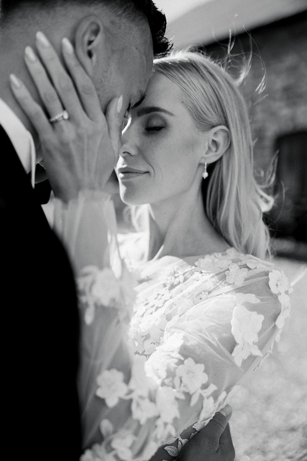 Black and white artistic sequence showing a bride in lace dress with hand raised to face in emotional moment.