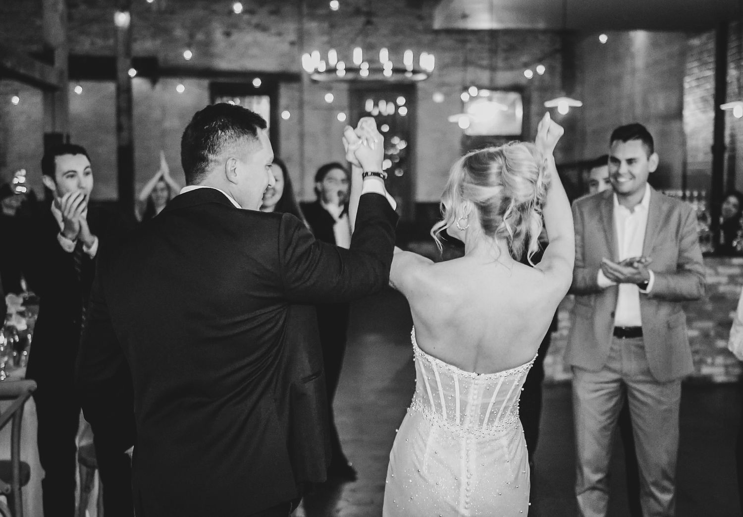 Bride and groom grand entrance into wedding reception
