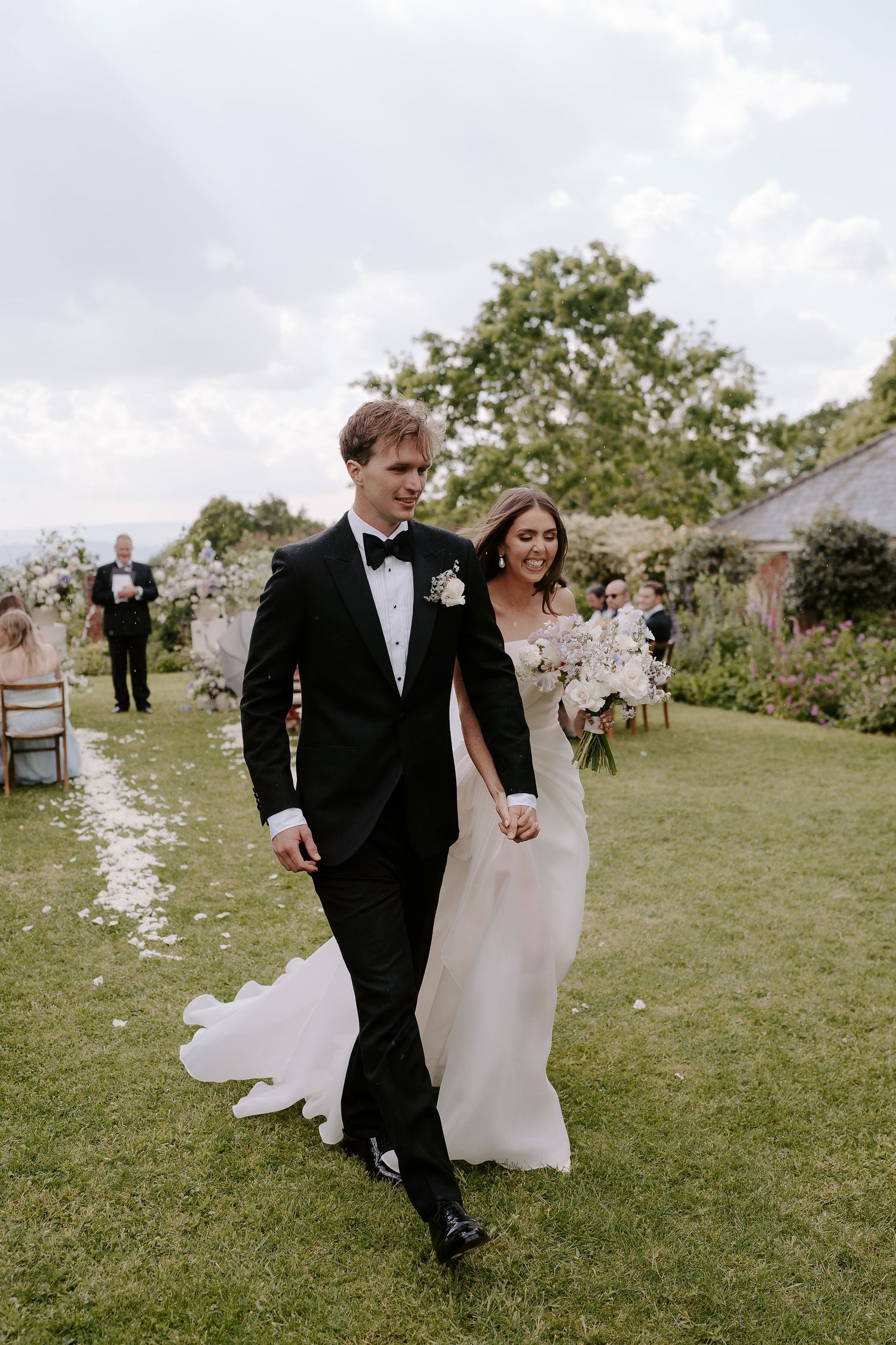 bride and groom walking down aisle as husband and wife at dewsall court in herefordshire