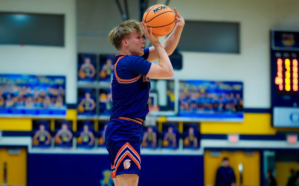 Hershey Trojans player lines up for a free throw, focused on the basket by SportsFox Photography, Hershey PA.