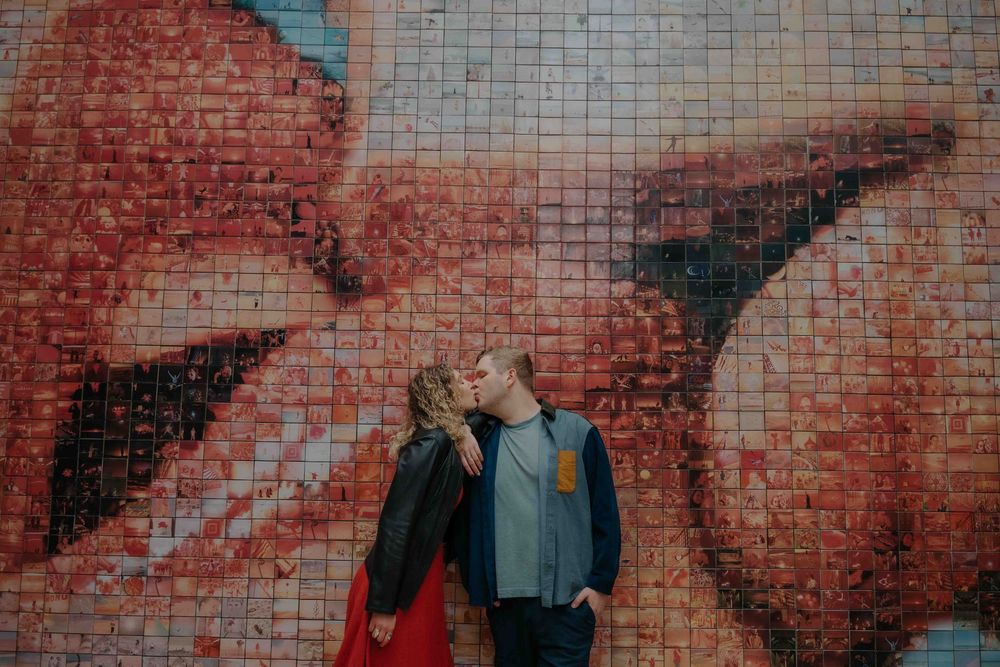 Soft morning light hitting the couple's faces in Barcelona.