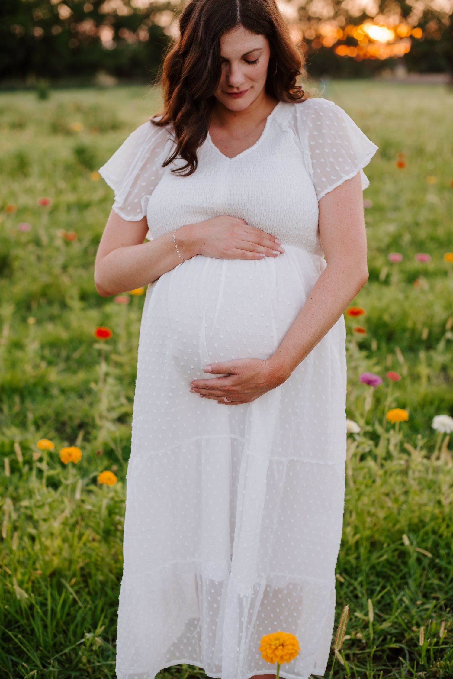 Flower field maternity session in Wichita Kansas by Jessica Nadine Photography