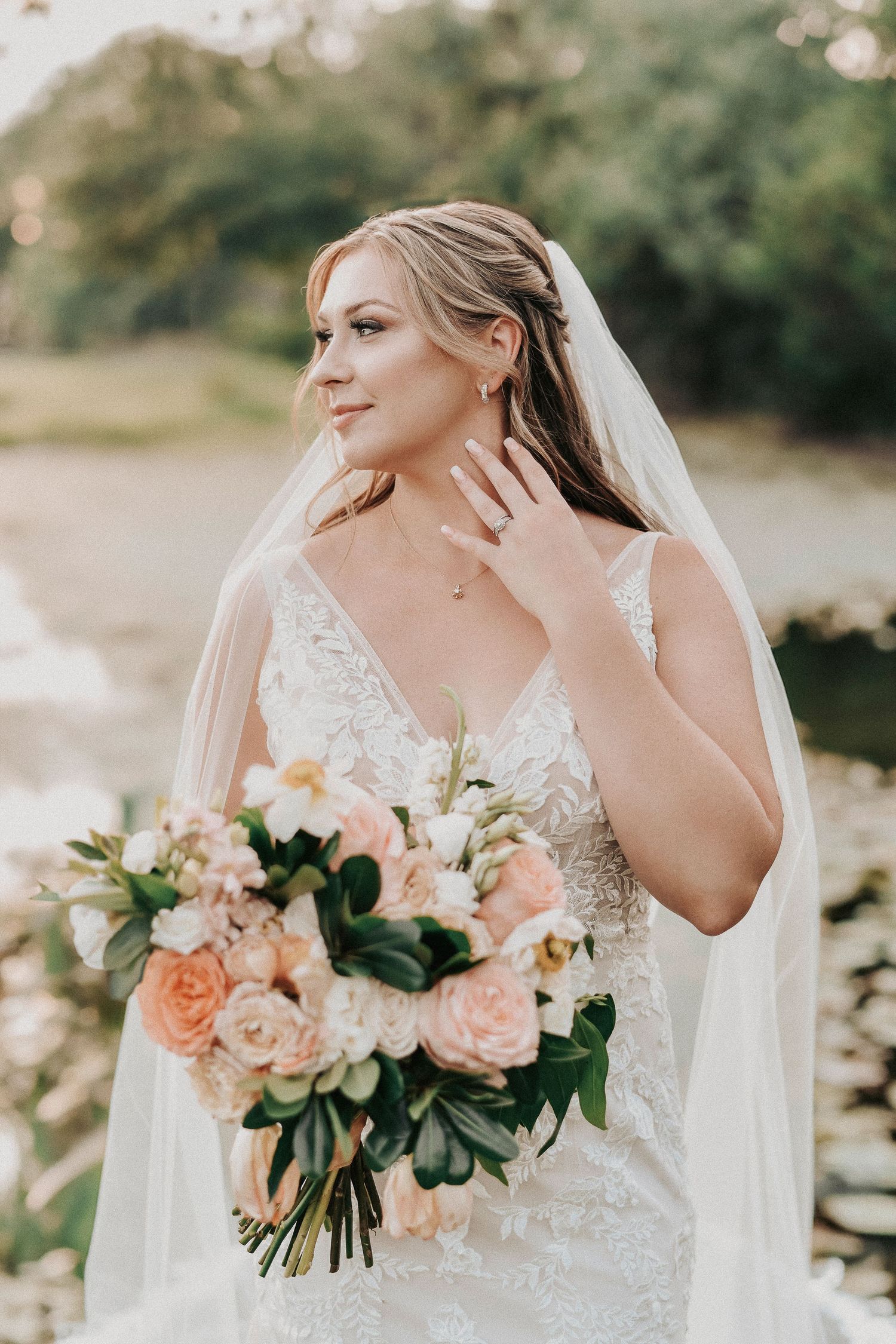 Timeless spring wedding couple portraits surrounded by natural greenery and oak trees.