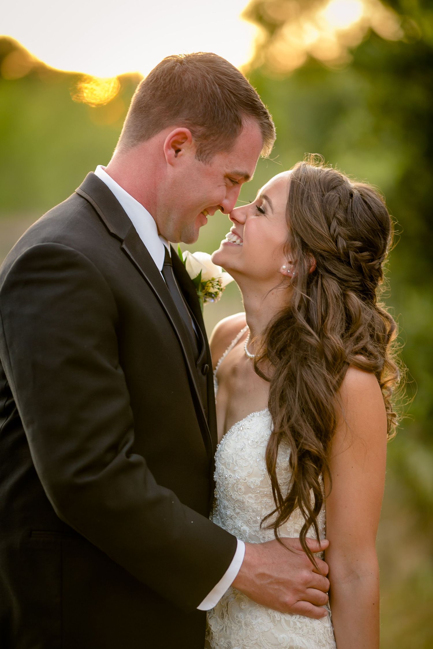 Romantic sunset wedding photo sequence shows couple in formal attire sharing intimate moments during golden hour.