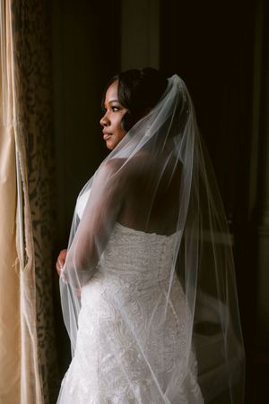 A series of artistic bridal portraits showing a wedding dress and flowing veil against a window with natural light.