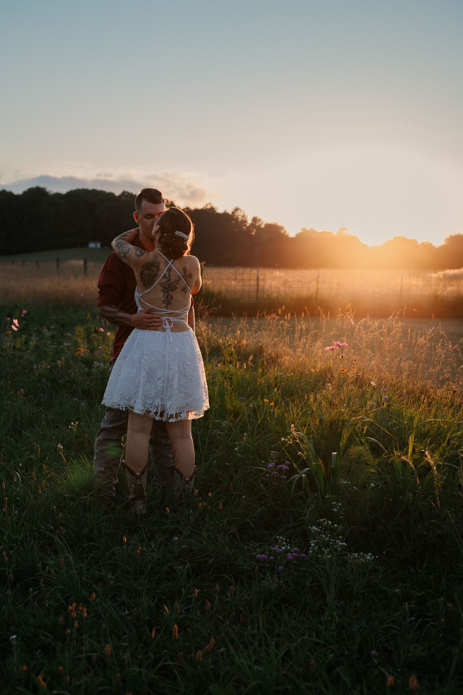 A romantic winter wedding portrait with a lake backdrop showing an intimate moment.