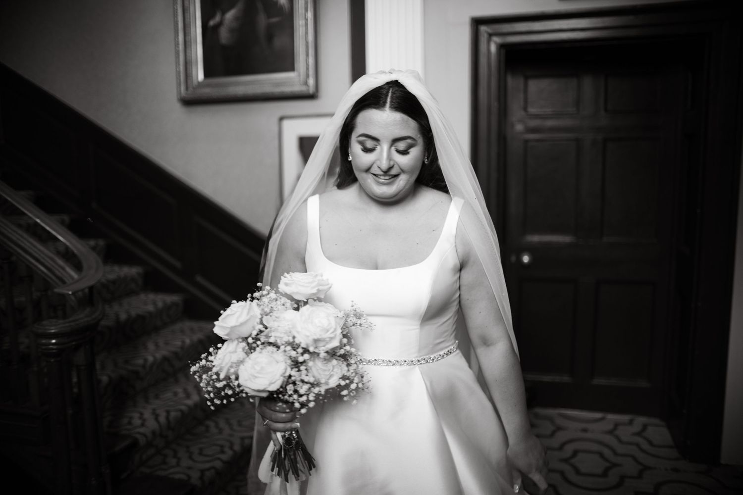 Intimate black and white bridal portraits on a staircase.