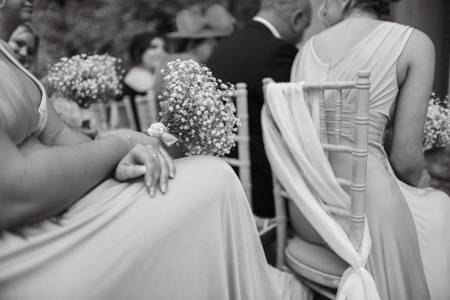 Candid wedding reception moments captured in black and white photography.