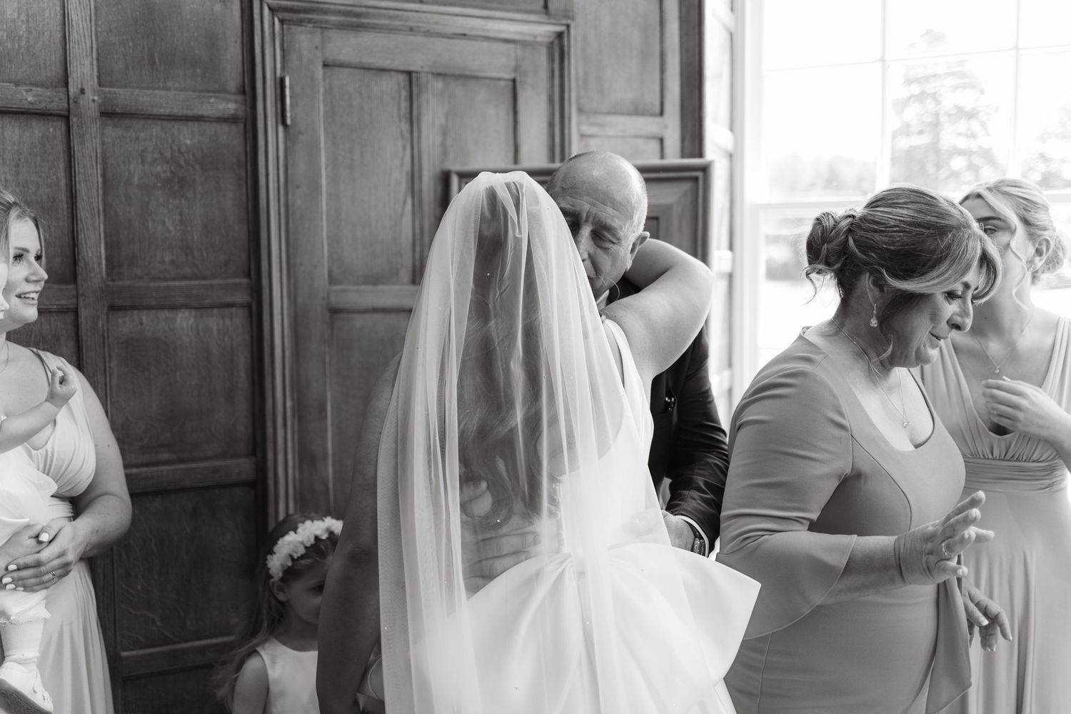 Series of black and white images showing wedding day preparations in a traditional room.