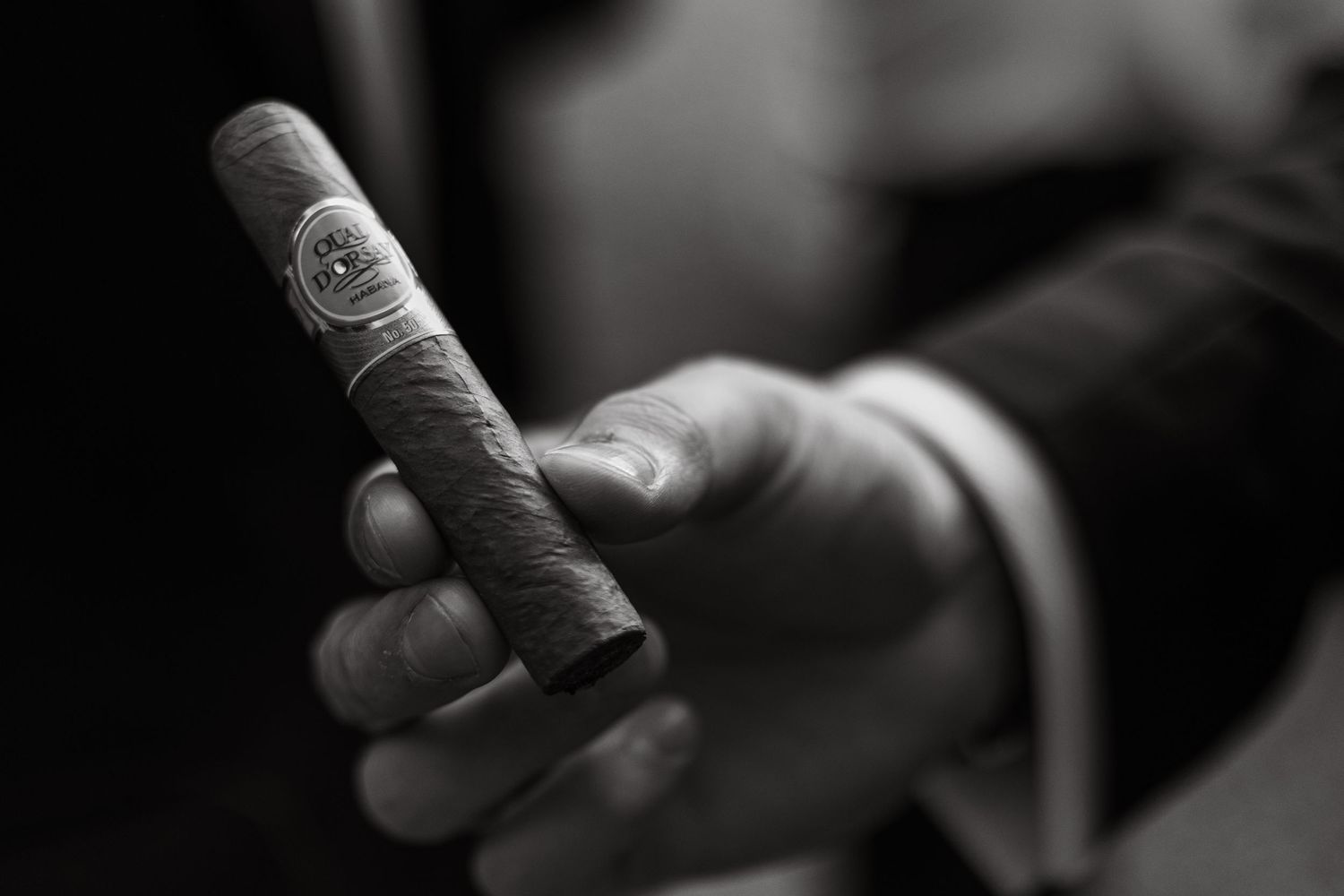 Close-up detail of hands during emotional wedding reception moment.
