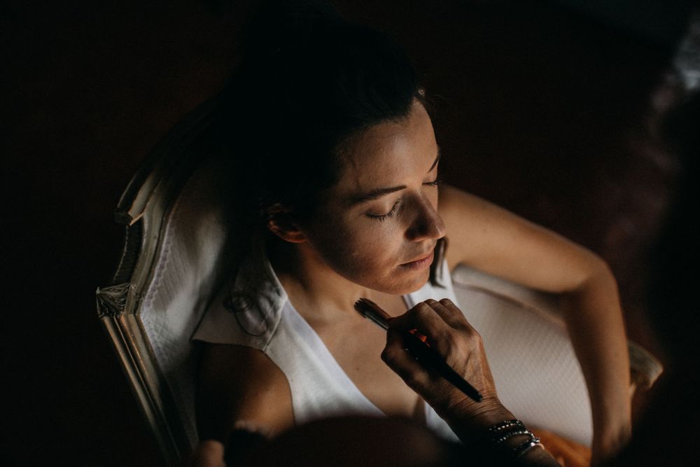 Portrait in dramatic lighting showing contemplative mood.