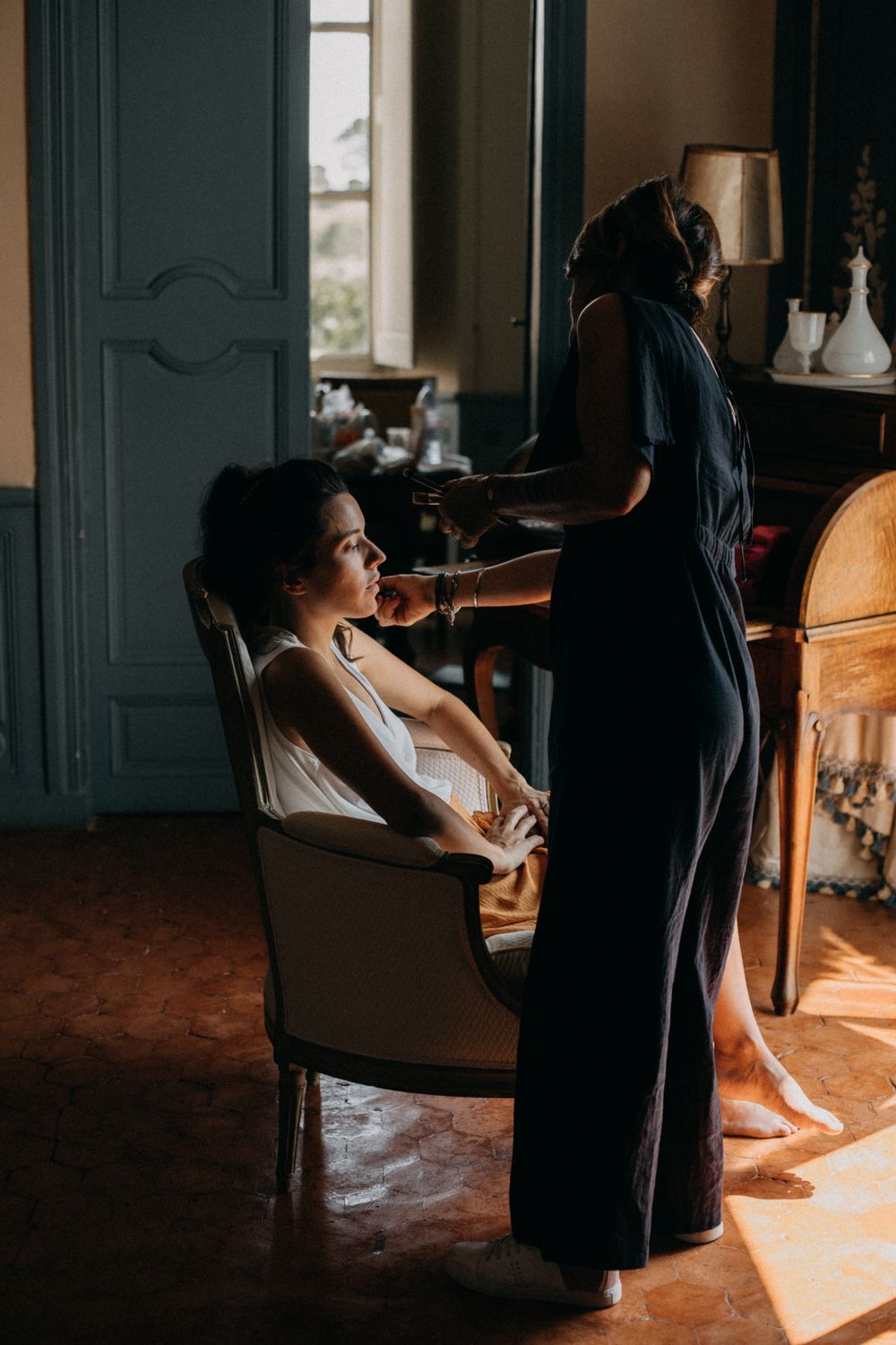 Preparation scene in sunlit room with elegant vintage furniture.