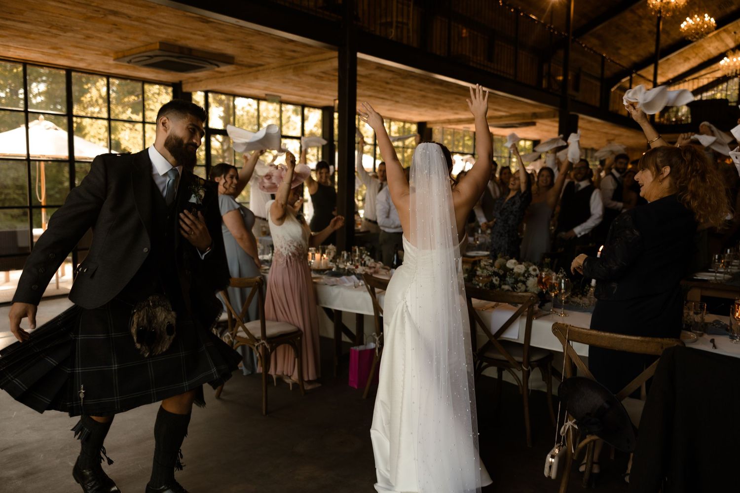 A sequence of wedding reception photos showing guests dancing and mingling at an indoor venue.