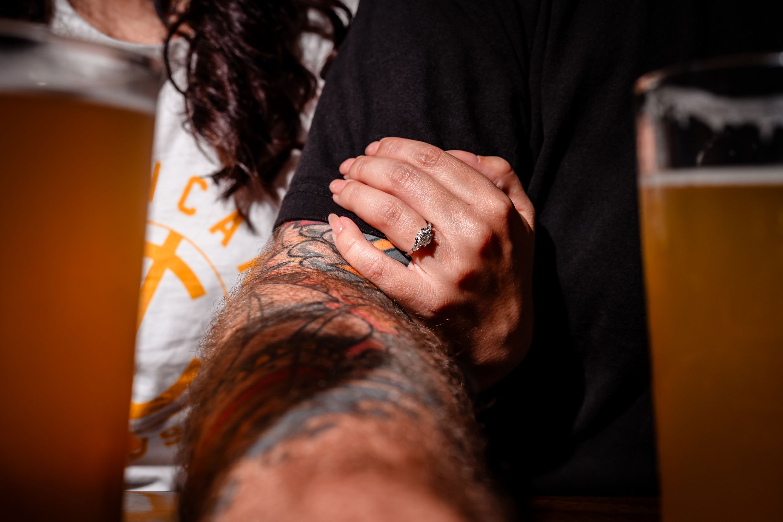 Romantic low-light bar scene with drinks and intimate atmosphere.