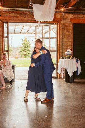 Dance sequence of couples performing dips and spins at a rustic barn wedding reception.