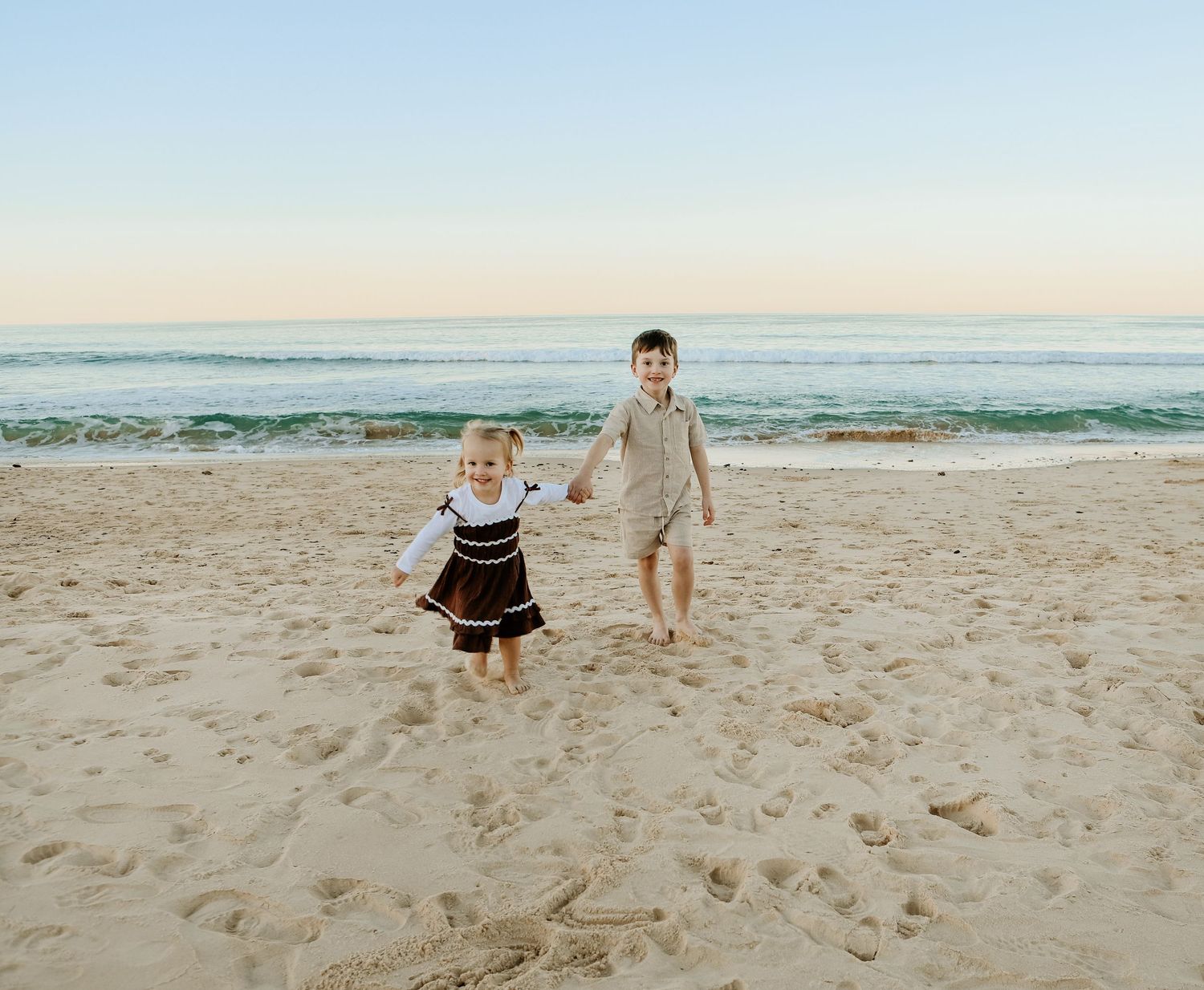 Brother and sister having fun at the beach
