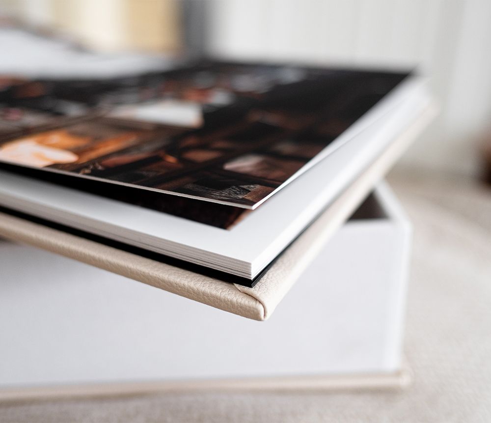 Close-up view of an open book with white pages and shallow depth of field.