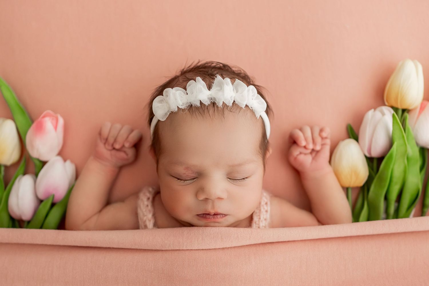 Close up view of a peaceful sleeping baby with soft focus in natural lighting.