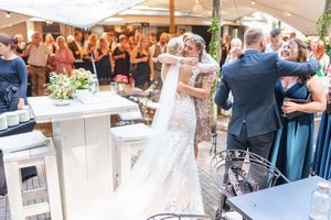 A series of wedding celebration photos showing guests, dancing, and reception moments at an elegant outdoor venue.