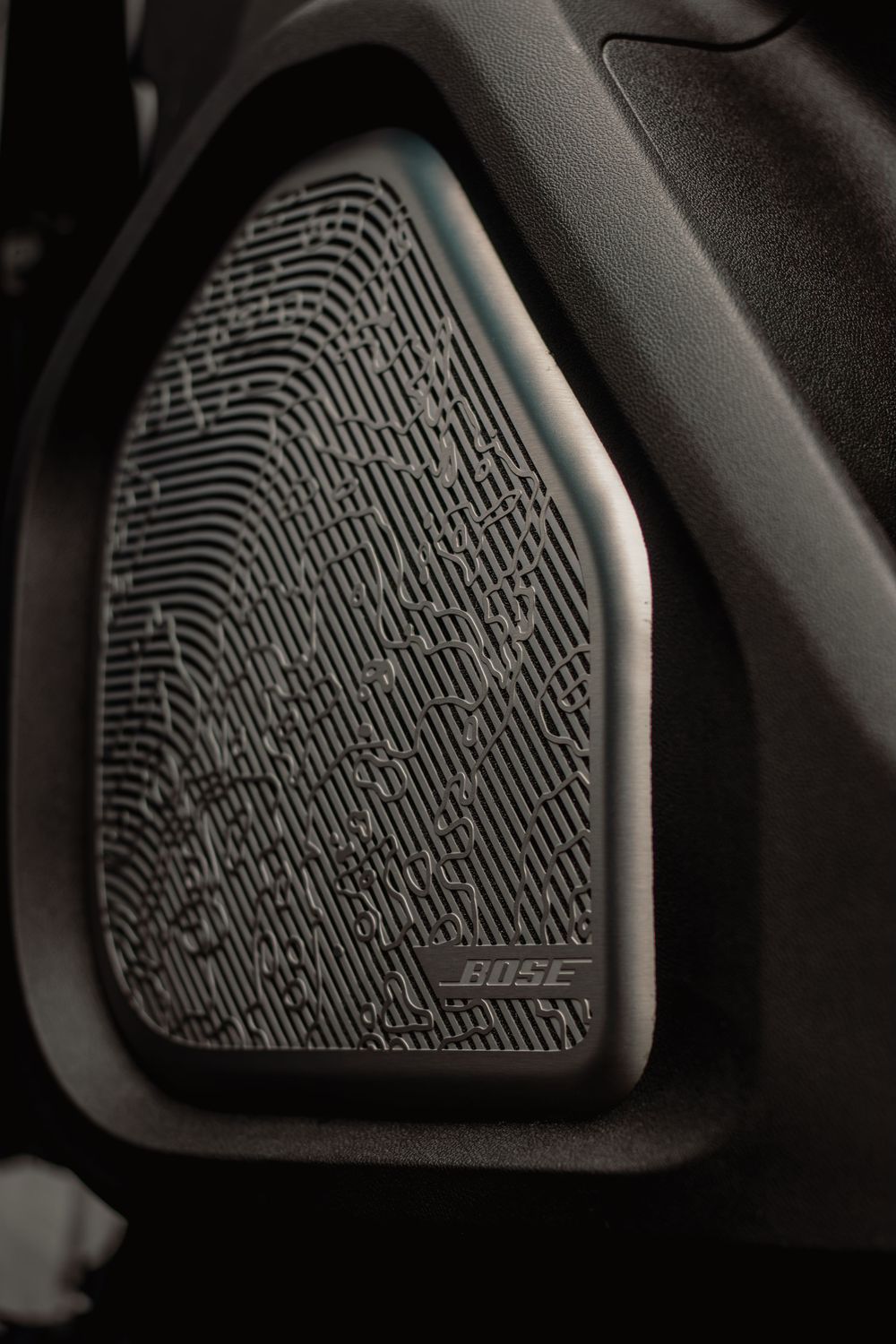 Series of detailed shots showing the textured pattern of a car speaker grille or audio component.