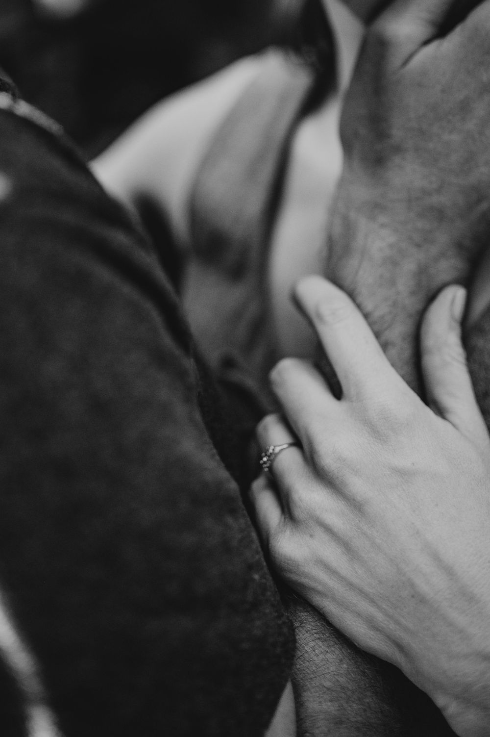Adventurous couple photographer photoshoot of couple in Cumberland Forest Vancouver Island engagement session detail ring shot