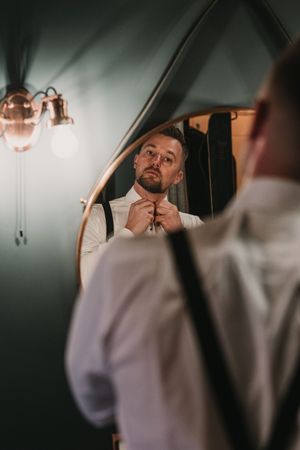 A sequence of intimate wedding day moments captured through car windows showing tender expressions and emotions.