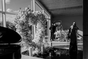 A series of black and white wedding photographs displayed in a horizontal filmstrip layout showing ceremony moments at Merrydale Manor