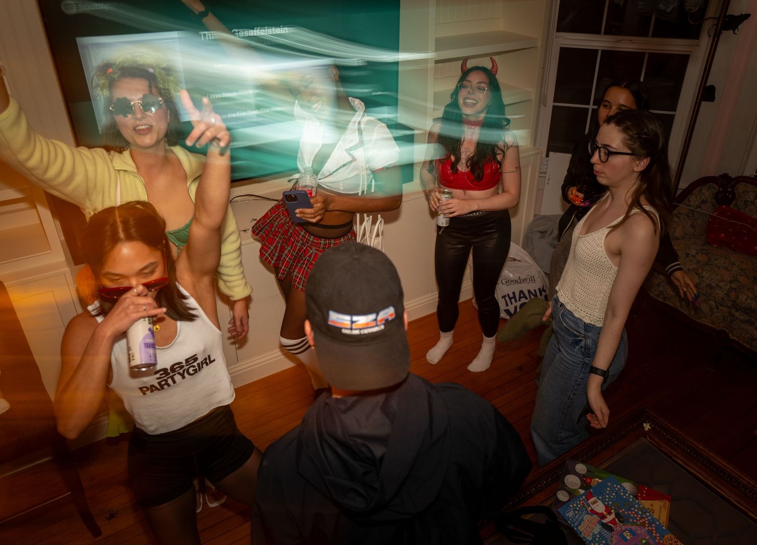 Young people dancing at a house party.