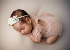 A collection of soft-focus newborn photography images showing tiny feet, delicate poses, and gentle lighting effects.