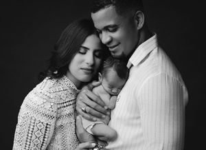 A series of intimate black and white photographs showing a couple embracing in tender romantic moments.