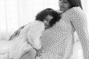 Black and white collage of tender moments between mother and baby showing nurturing and bonding.