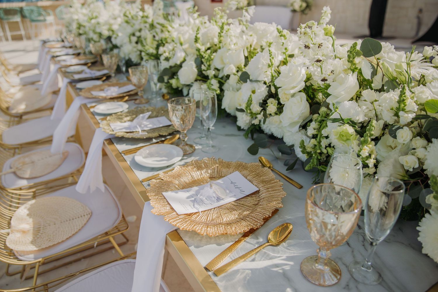 Elegant wedding reception tables decorated with white floral centerpieces, Dreams Sapphire Riviera Maya Wedding Photography
